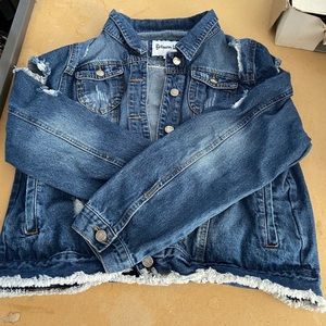 Ripped up denim jacket, slightly worn & washed